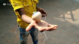 This video is about kid playing with spinning toy latim /lattu also
can be say that how to spin a top using rope. in bangladesh rural
children are very ...