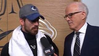 Garland speaks with S.Oake after scoring the game-winning goal in Vancouver's comeback win in Game 1