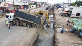 Dump Truck TRAGO 22.5T Uploading rock In small Deep Foundation Road Expansi& CATERPILLAR D4C  Dozer