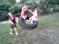 Evie  pokkie on the tire swing at the rowland ranch