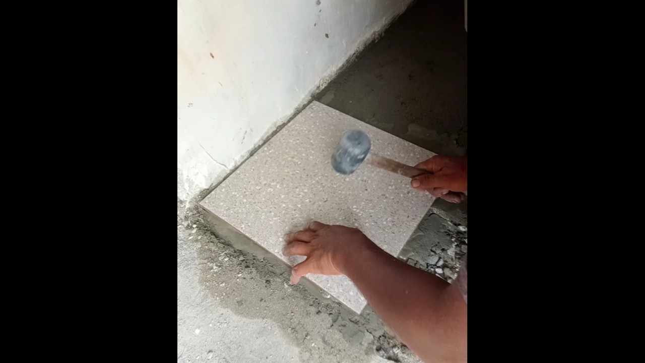 installing tiles on the bathroom floor