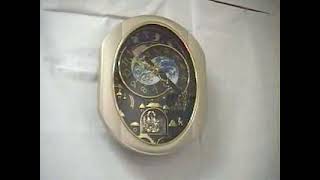 Peaceful Cosmos Rhythm Magic Motion Clock 4MH751AR19
