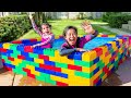 Jannie and Ellie Learn to Swim in the Kids Lego Pool and Plays with Fun Water Toys