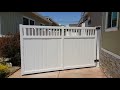 Motorised single swing gate, white vinyl privacy with picket on top.