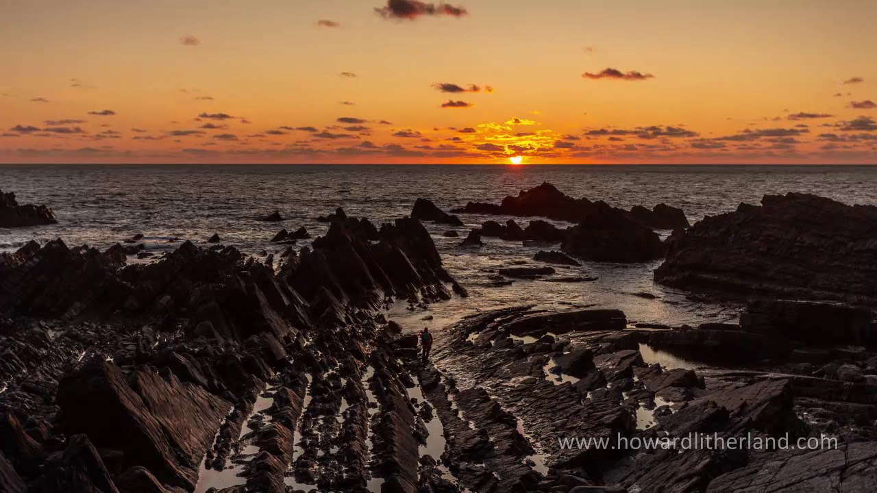 Time lapse of sunset over the Atlantic ocean at Hartland Quay, Devon