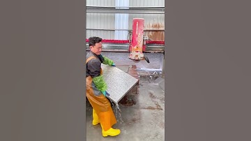 Stone Cutting Workshop: Skilled Worker Stacking Granite Slabs