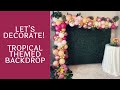 Tropical Themed Balloon Decorations | Boxwood Hedge Backdrop