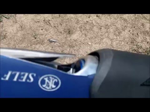 FNH SLP Shotgun Loading Port Opened for Quad Loads