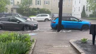 River of water flows down Providence street