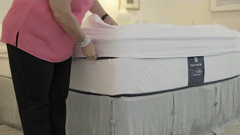 Putting the Better Bedder® on your mattress. No more tucking sheets under your heavy mattress!