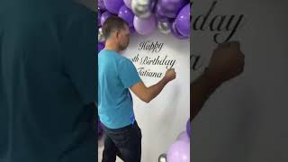 Purple balloon arch | round backdrop with balloon arch