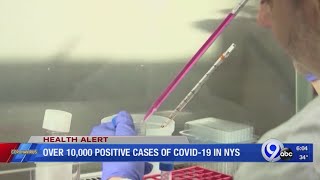NY airports, hospitals under pressure as virus cases mount