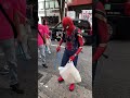 SpiderMan picking up trash in Tokyo