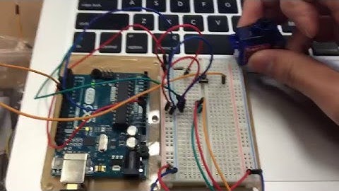 Servo motor controlled by a pushbutton momentary switch