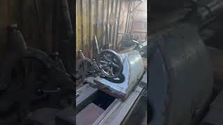 Automatic shaft turning on a lathe machine.