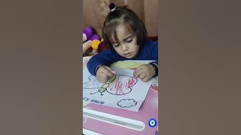 Little girl doing bindi pasting activity  , interesting fine motor skills,  easy to do