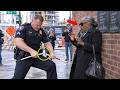 Racist Cop Breaks Blind Black Woman’s Cane in Public—But Has No Clue Who Her Son Really Is