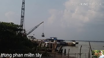 CẢNH HAI CHIẾC SÁNG DÂY CẠP CÁT TRÊN XÀ LAN SANG QUA GHE  TRÊN SÔNG HẬU. trung phan miền tây
