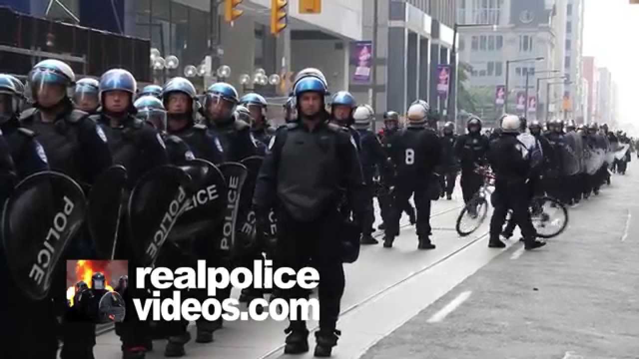 Riot police line marching and forming group in large numbers - - YouTube