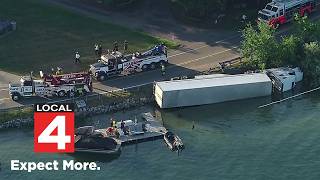Semi overturns into Pine Lake along Orchard Lake Road in West Bloomfield; driver suffers injury