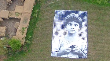 Not a Bug Splat: Artists Confront U.S. Drone Operators With Giant Picture of Pakistani Child