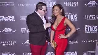 Daphne Joy in a stunning red dress at Project Ethos fashion show