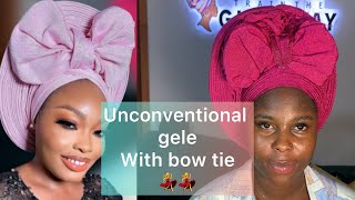 Unconventional gele style with bow tie  must watch guys #trainthegiddyway #gele #makeup #fy