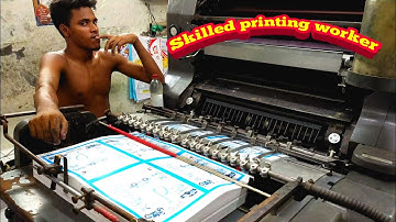 Heidelberg offset printing machine working. Skilled workers