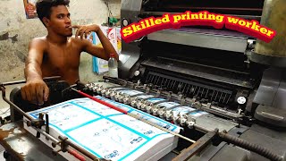 Heidelberg offset printing machine working. Skilled workers