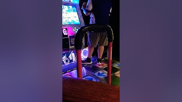 Fat man plays DDR