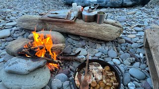 Solo camping fishing and cooking on beach.