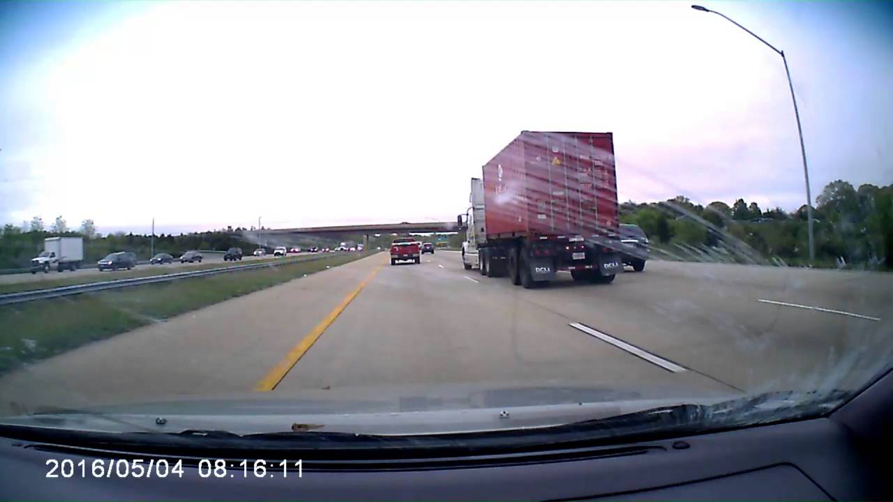 Dashcam video of running into debris on the highway - YouTube