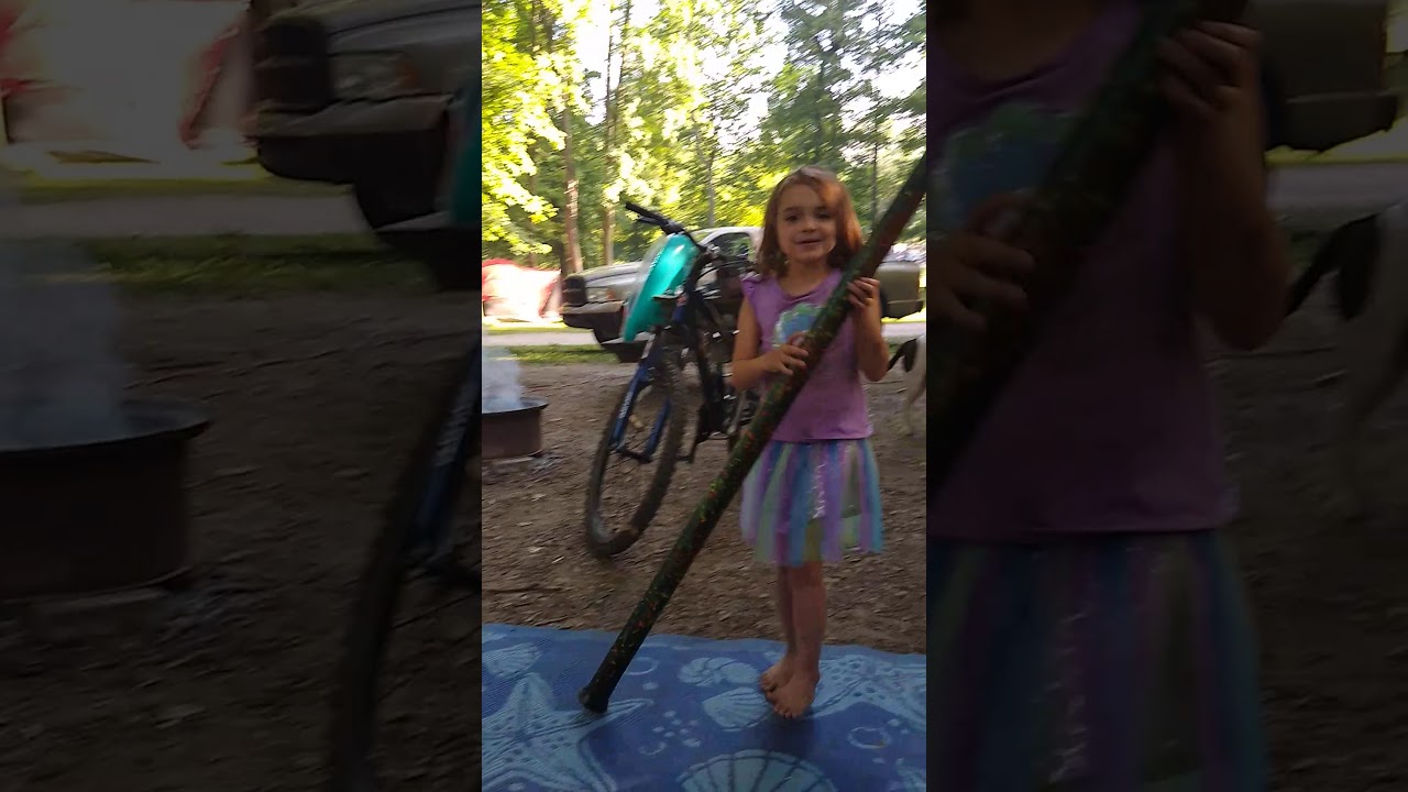 homemade didgeridoo little girl playing didgeridoo dancing camping life