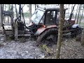 Belarus Mtz 1221.2 with large homemade trailer logging in wet spring forest, difficult conditions