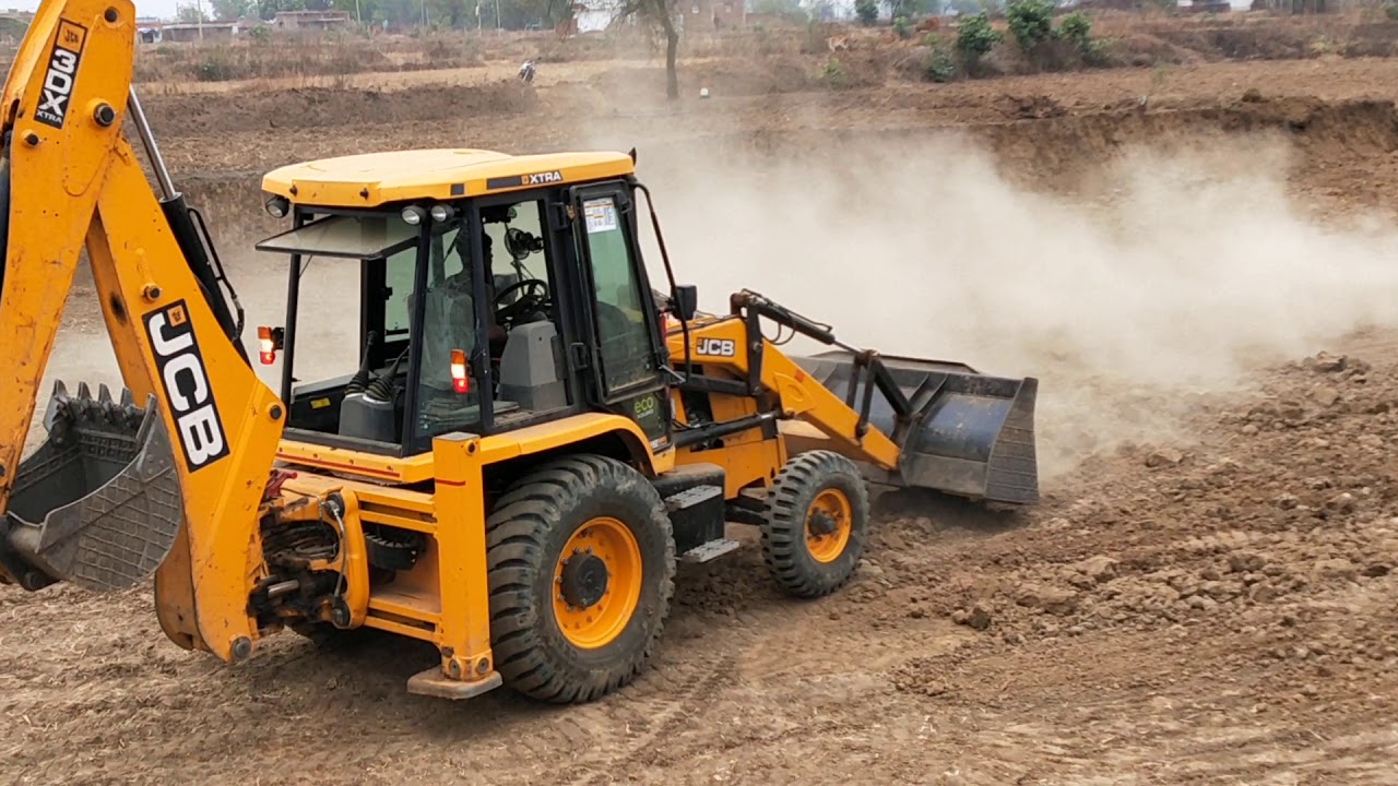 JCB Machine Collecting Mud and Loading in Tractor - JCB Backhoe Leveling Ground 