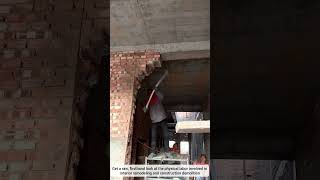 Using a Sledgehammer to Tear Down an Interior Brick Wall