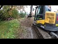 Excavator Volvo ECR 145DL digging pit & Kubota KX057-4 / Cab view / 4K