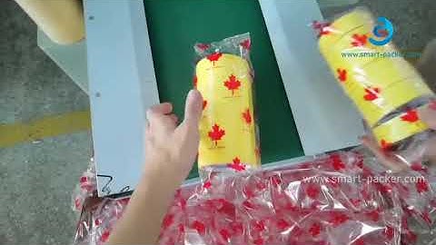 Automatic tape rolls feeding horizontal type pillow bag packing machine with tape rolls detecting fi