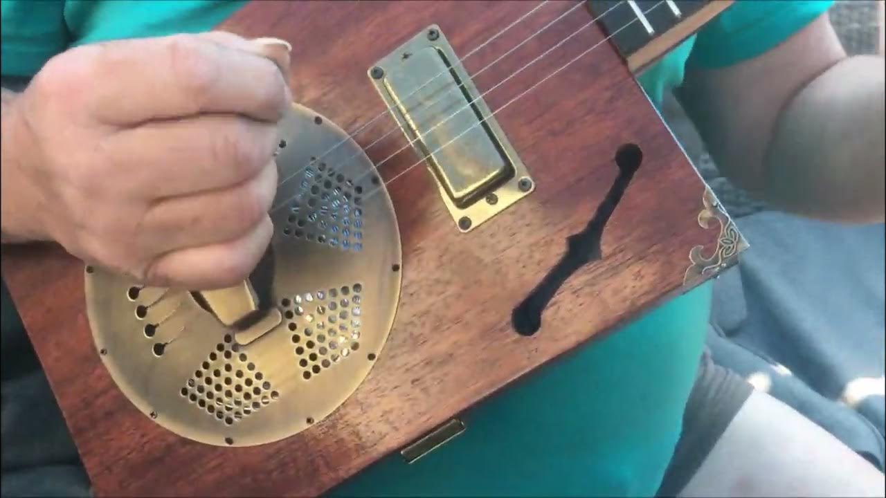 The Ray Reso a 4 string cigar box resonator cigar box guitar built by