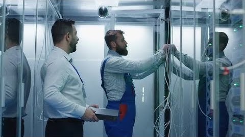 Data Experts Installing Server Racks Stock Video