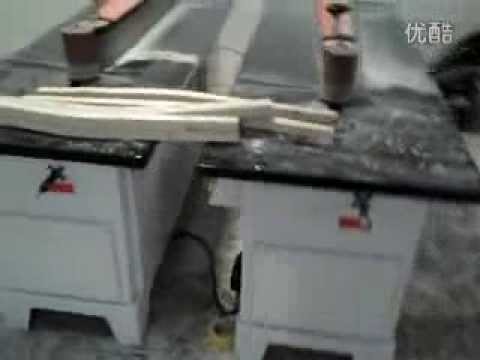 machine gun sanding the chair leg