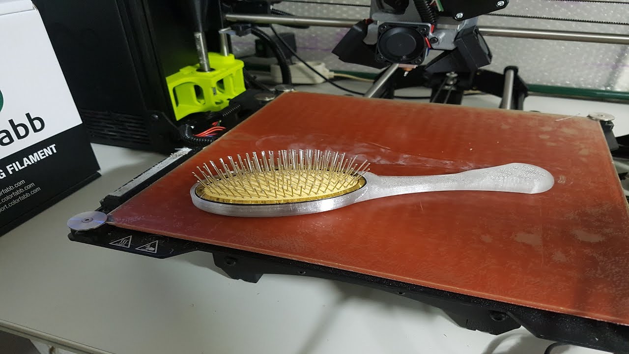 I designed and 3D printed a human sized hairbrush to outfit a