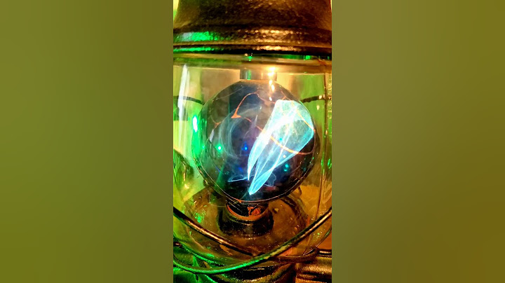 Blue Globe Style Balafire Flame Light Bulb in a Hurricaine Lamp