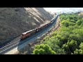 4K: Drone View of a Train Rounding Horseshoe Curve