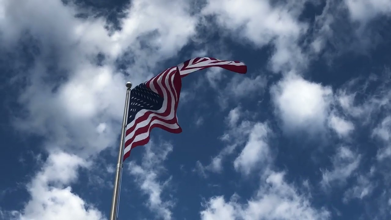 Old Glory flying with Gorgeous Cloud Background