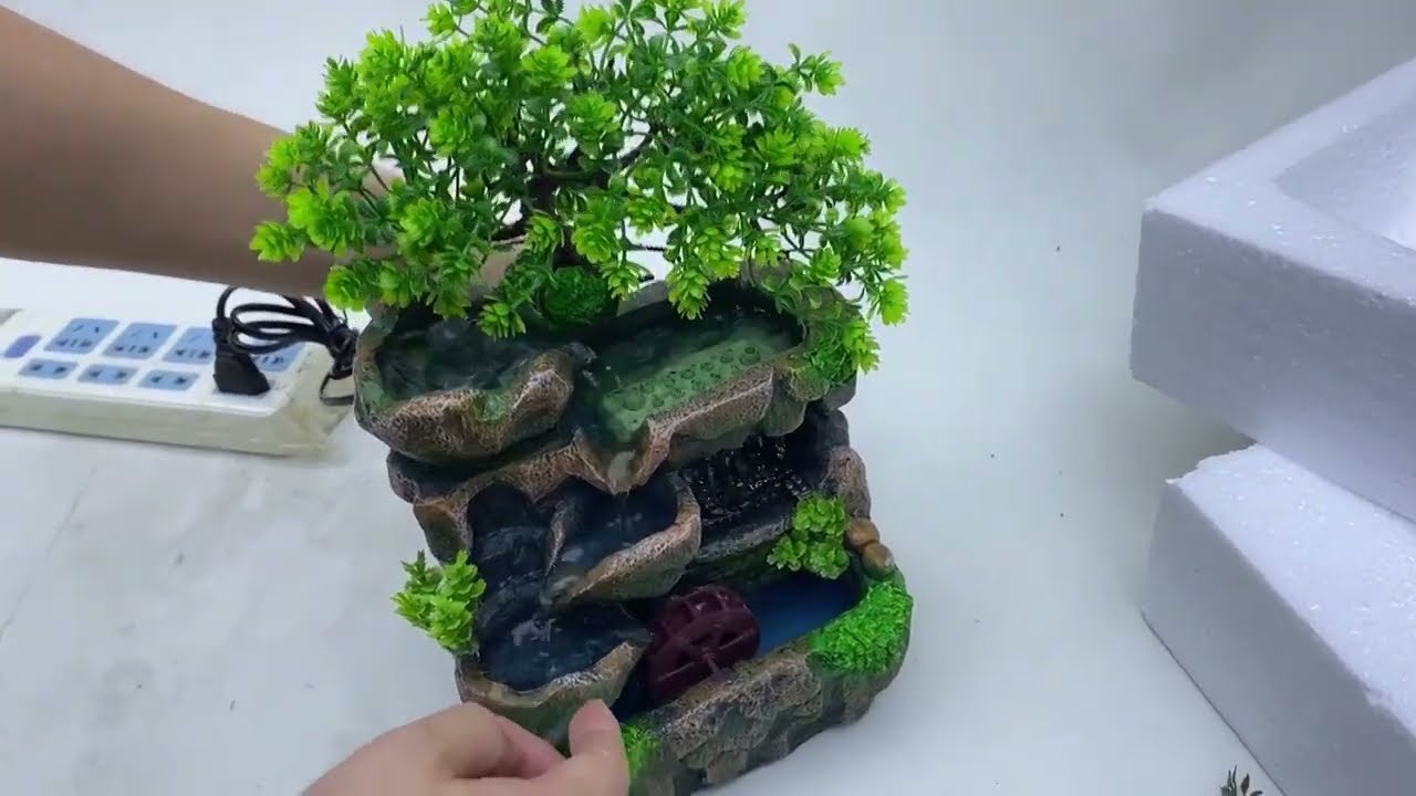 Découvrez la petite fontaine zen d'intérieur avec roue à aubes et Led pour une ambiance apaisante