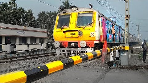 Amazing Aerodynamic Face Advertise printed EMU Skip Busy Railroad | Speedy Trains at Level Crossing