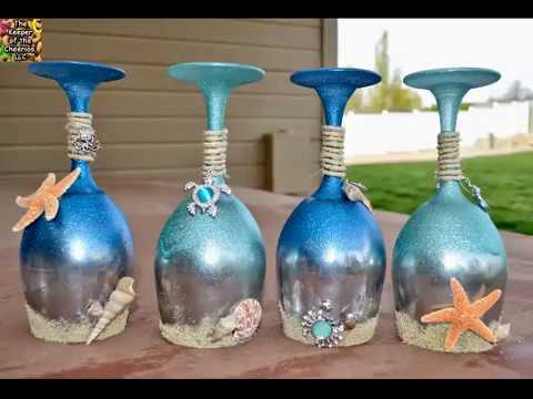 تصویری: شمعدان های شیشه ای: شمعدان های شیشه ای رنگی روی پایه بلند و شمعدان توپی ، فلاسک های شفاف و مدل های دیگر