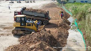 Process Build Pour Soil To Fill The Water Side By Operator Skills Shantui Bulldozer And Dump Trucks