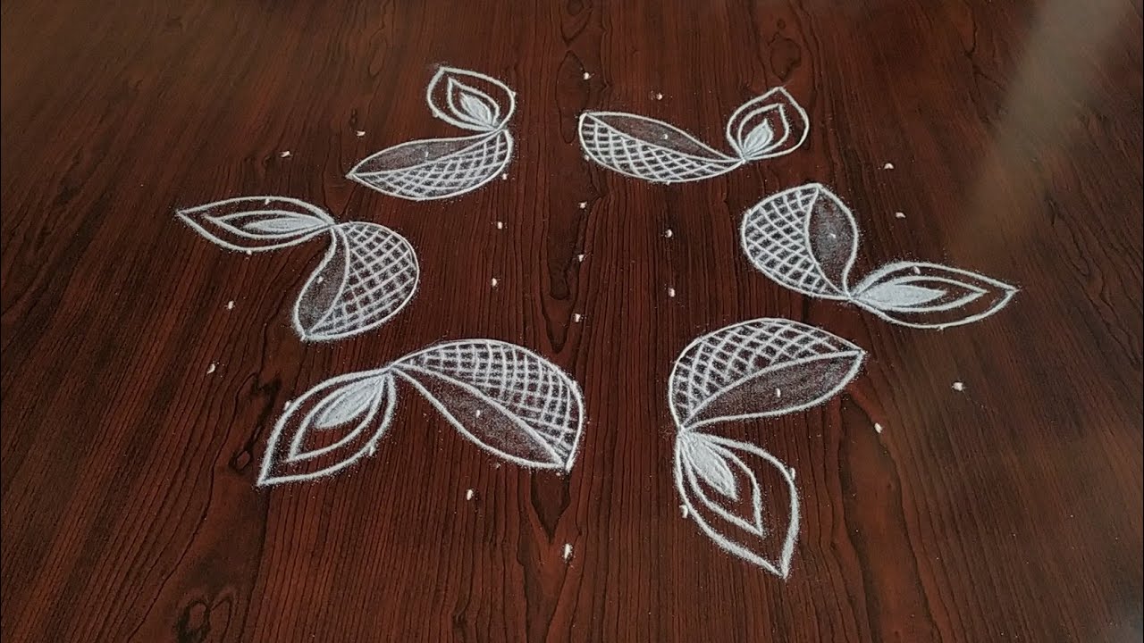 Sankarthi chukkala muggulu // Beautiful deepam kolam with amazing peacocks only 9*5 dot's